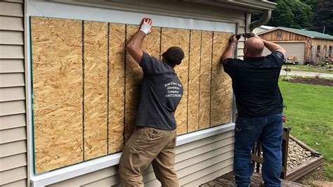 metal sheets for boarding up windows|how to board a window.